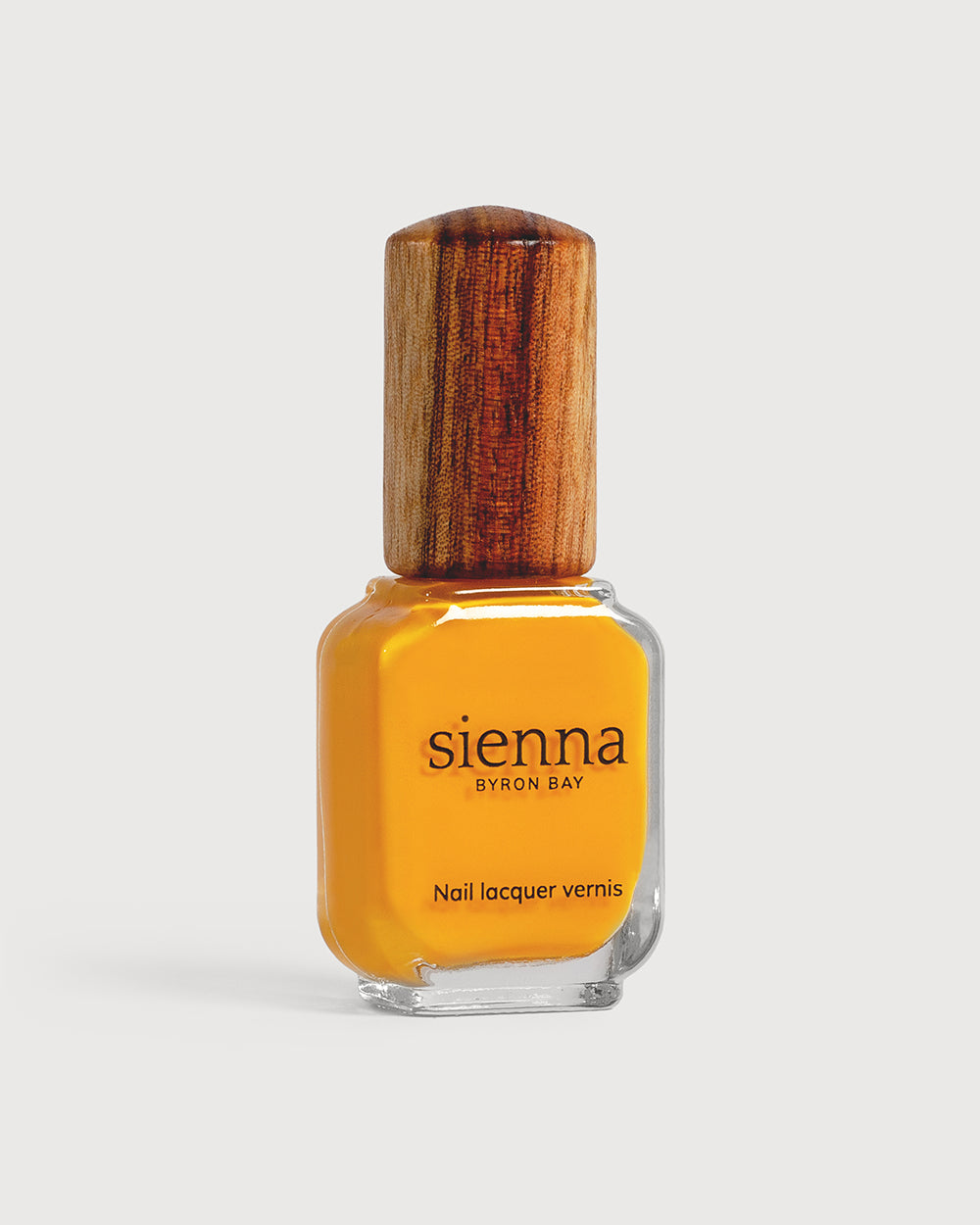 Sunflower yellow creme Sienna nail polish bottle with timber cap