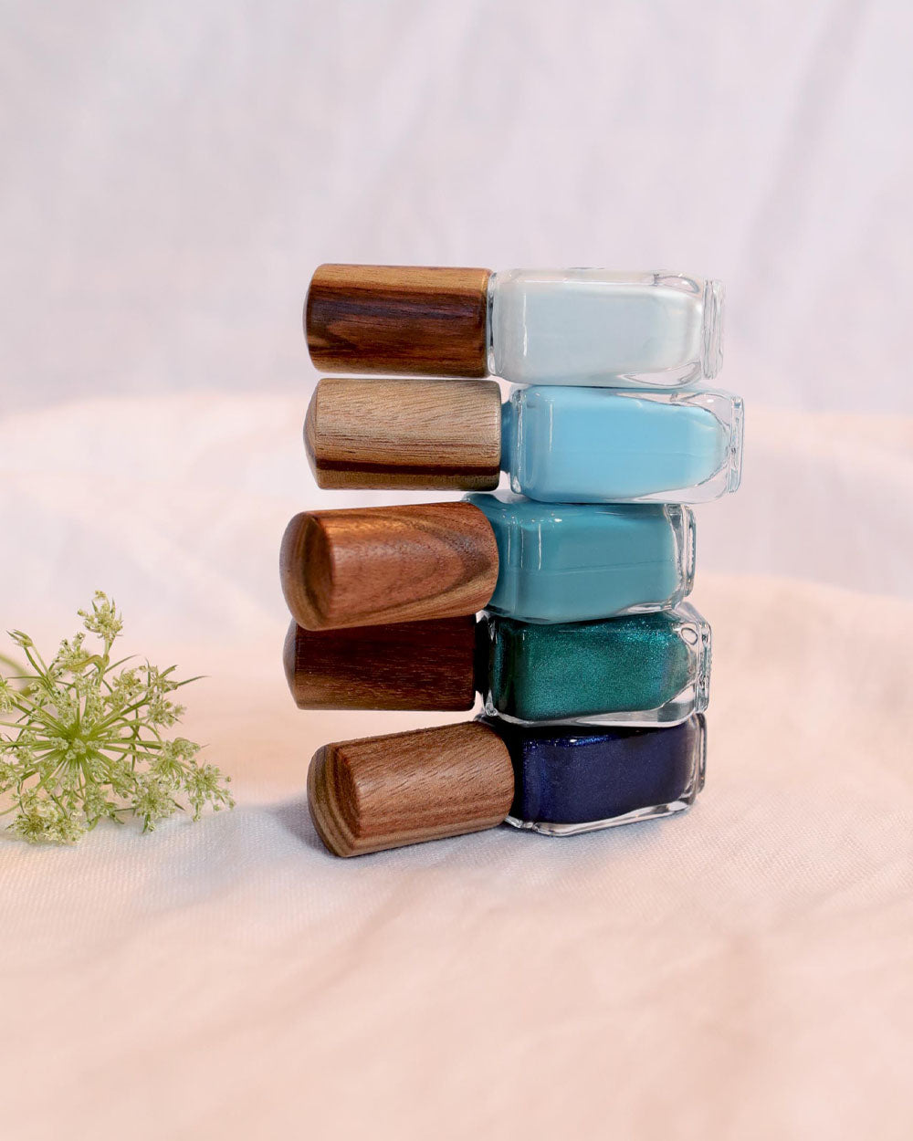 Horizon Quin five-polish collection glass bottles with timber caps by Sienna