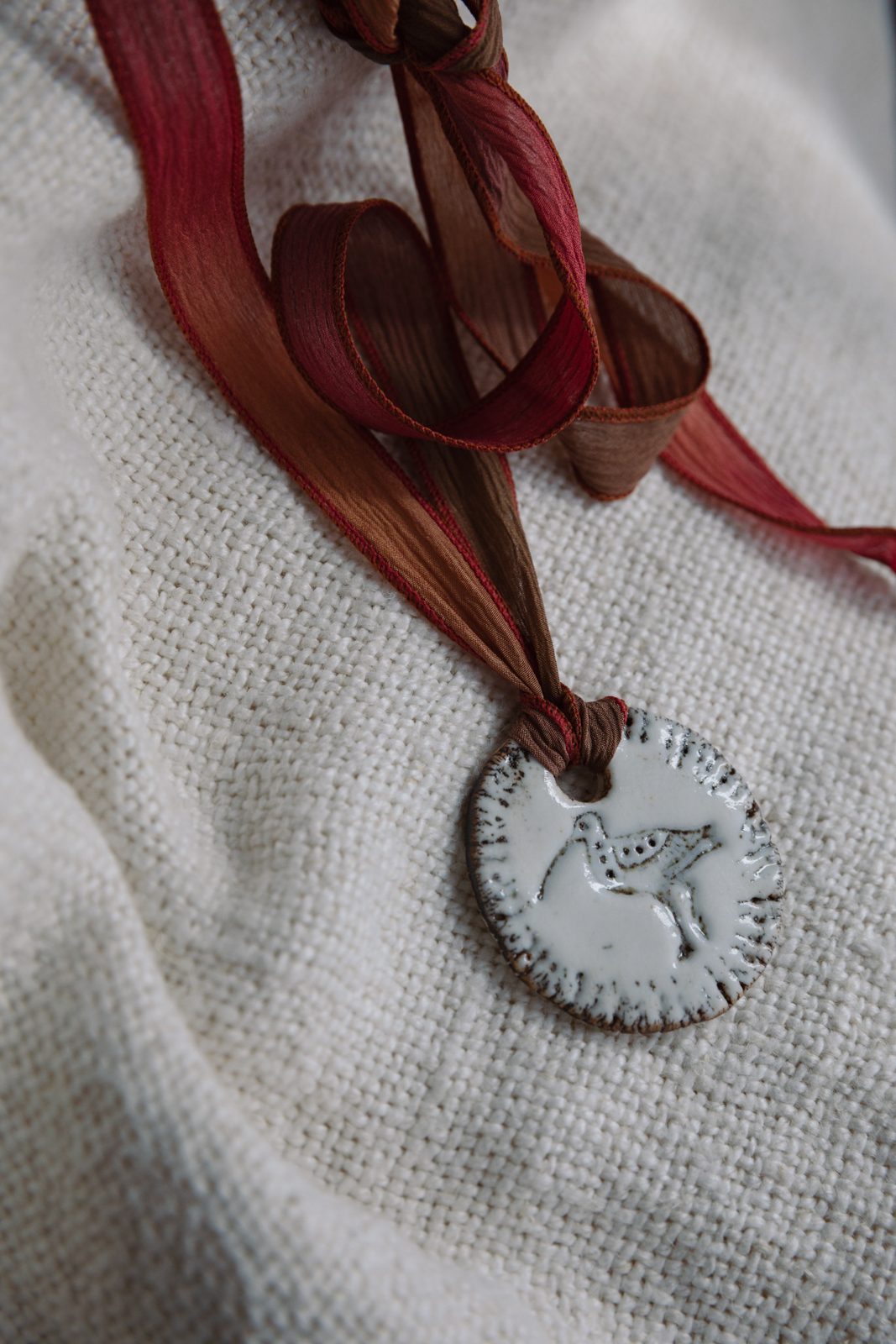 Gindi Girl Dust Rose ceramic pendant necklace