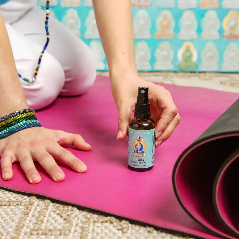 Chakra Balancing Mist on yoga mat by Perfect Potion