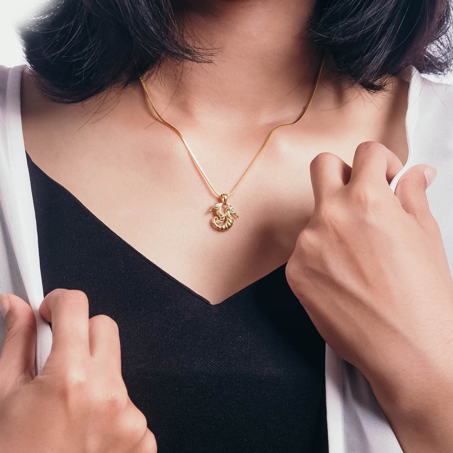 Sunaka Seahorse double pendant worn