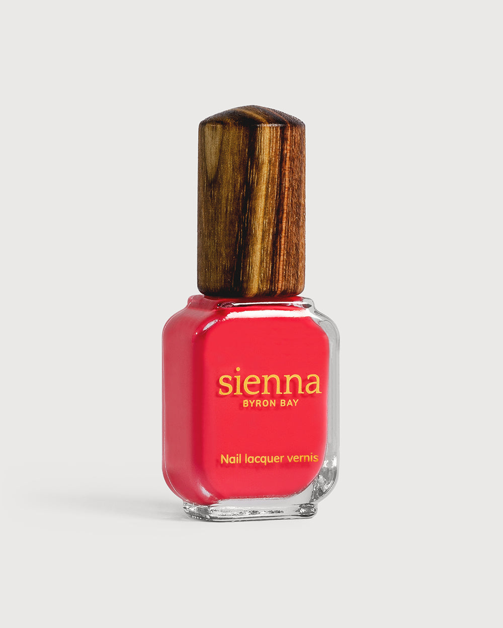 Kiss bold pink creme Sienna nail polish bottle with timber cap