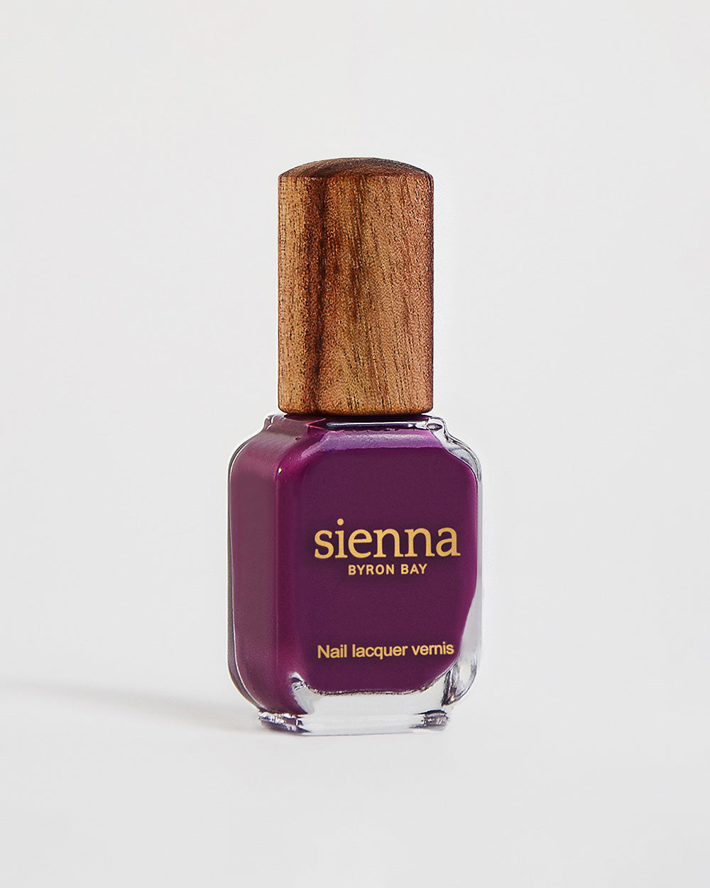 Reverence violet grape creme Sienna nail polish bottle with timber cap