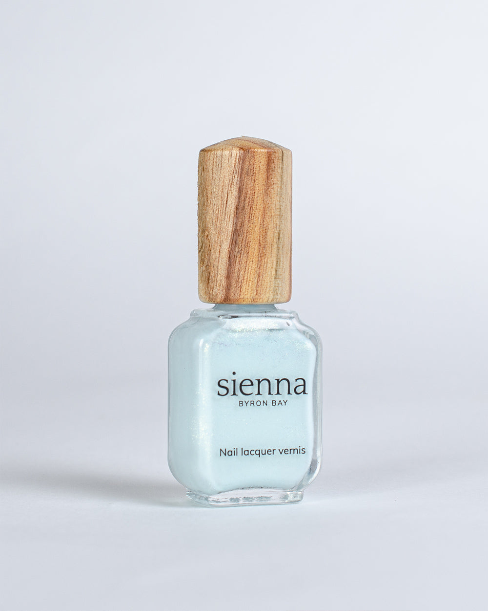Skye pale blue metallic shimmer glaze Sienna nail polish bottle with timber cap