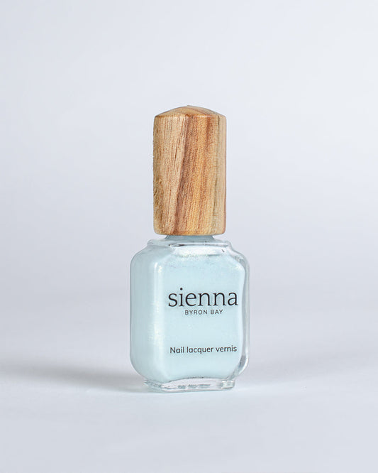 Skye pale blue metallic shimmer glaze Sienna nail polish bottle with timber cap