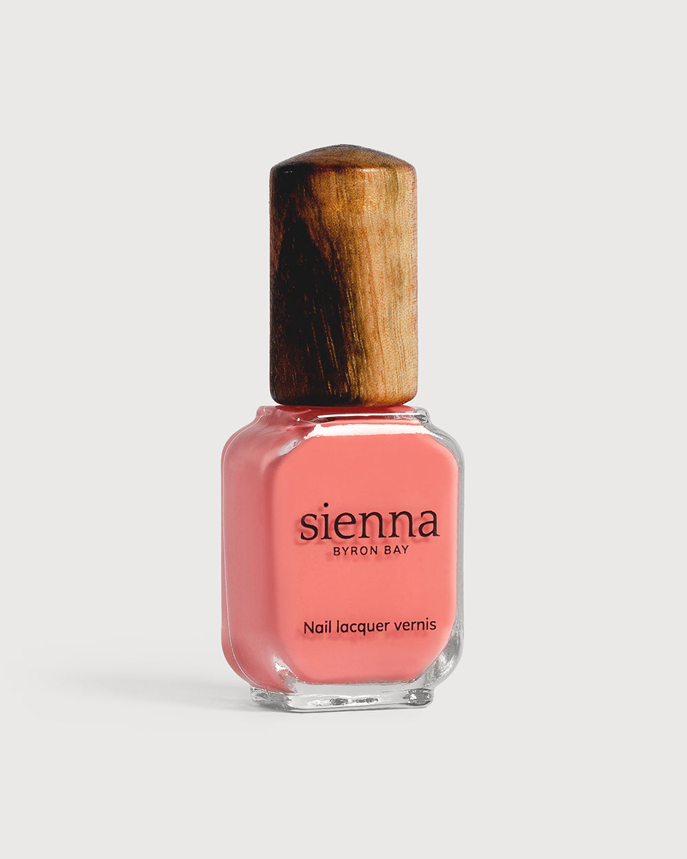 Sweetheart peachy pink creme Sienna nail polish bottle with timber cap
