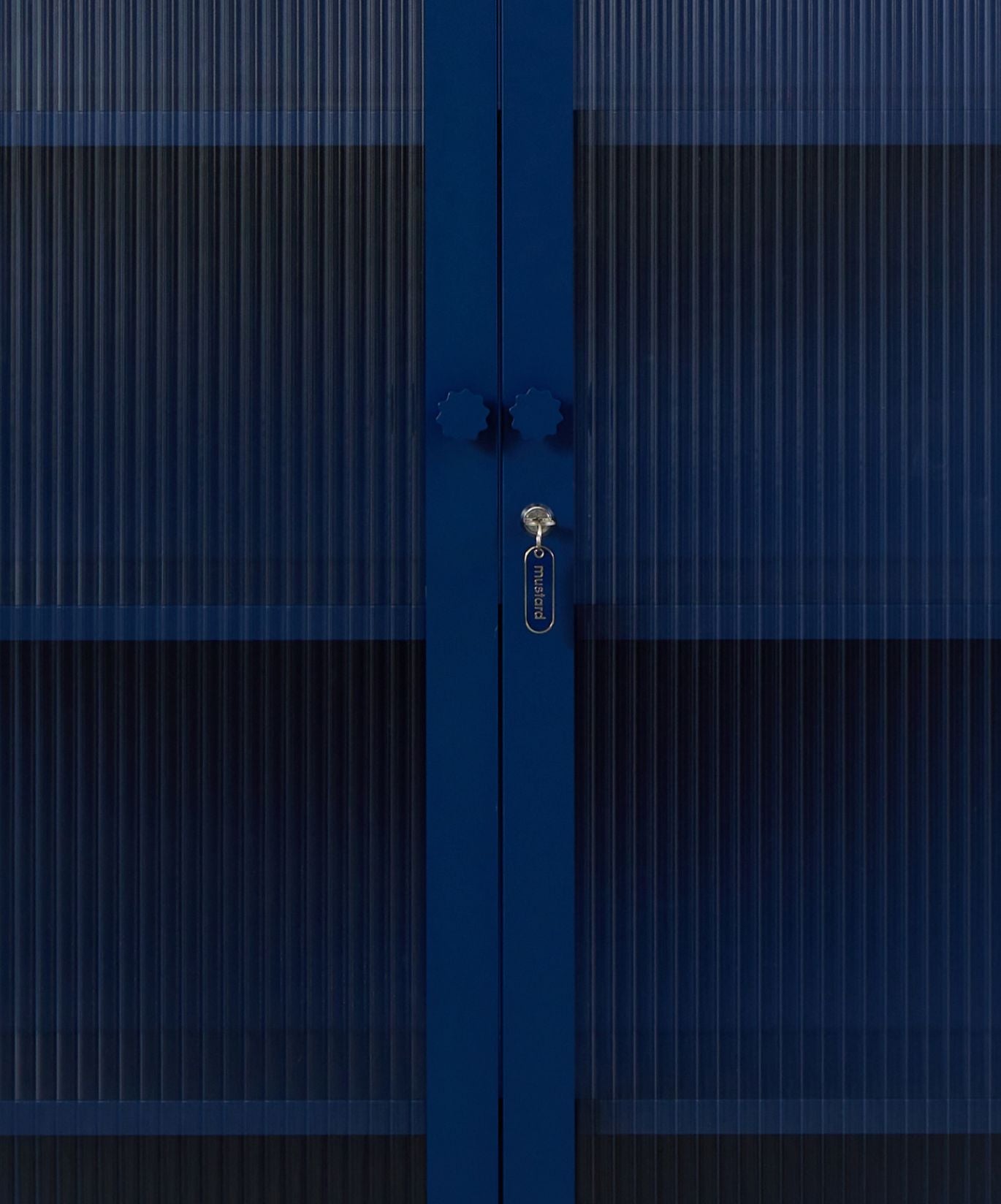 The Collector Glass Locker in Navy — close-up