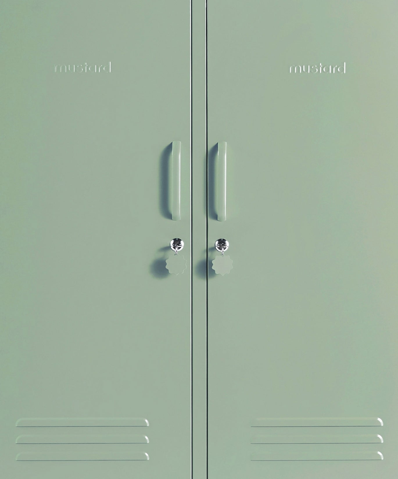 The Midi Locker in Sage — close-up