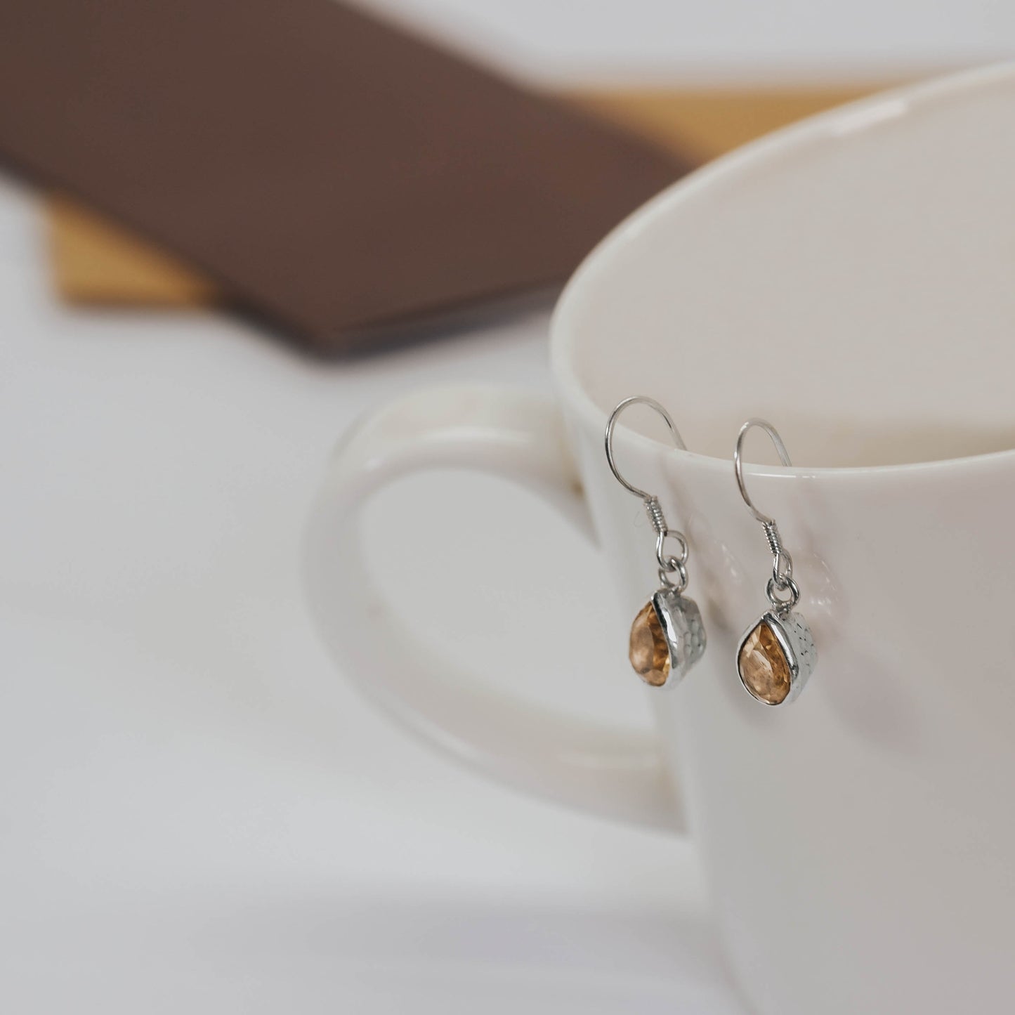 Sunaka hammered garnet earrings styled